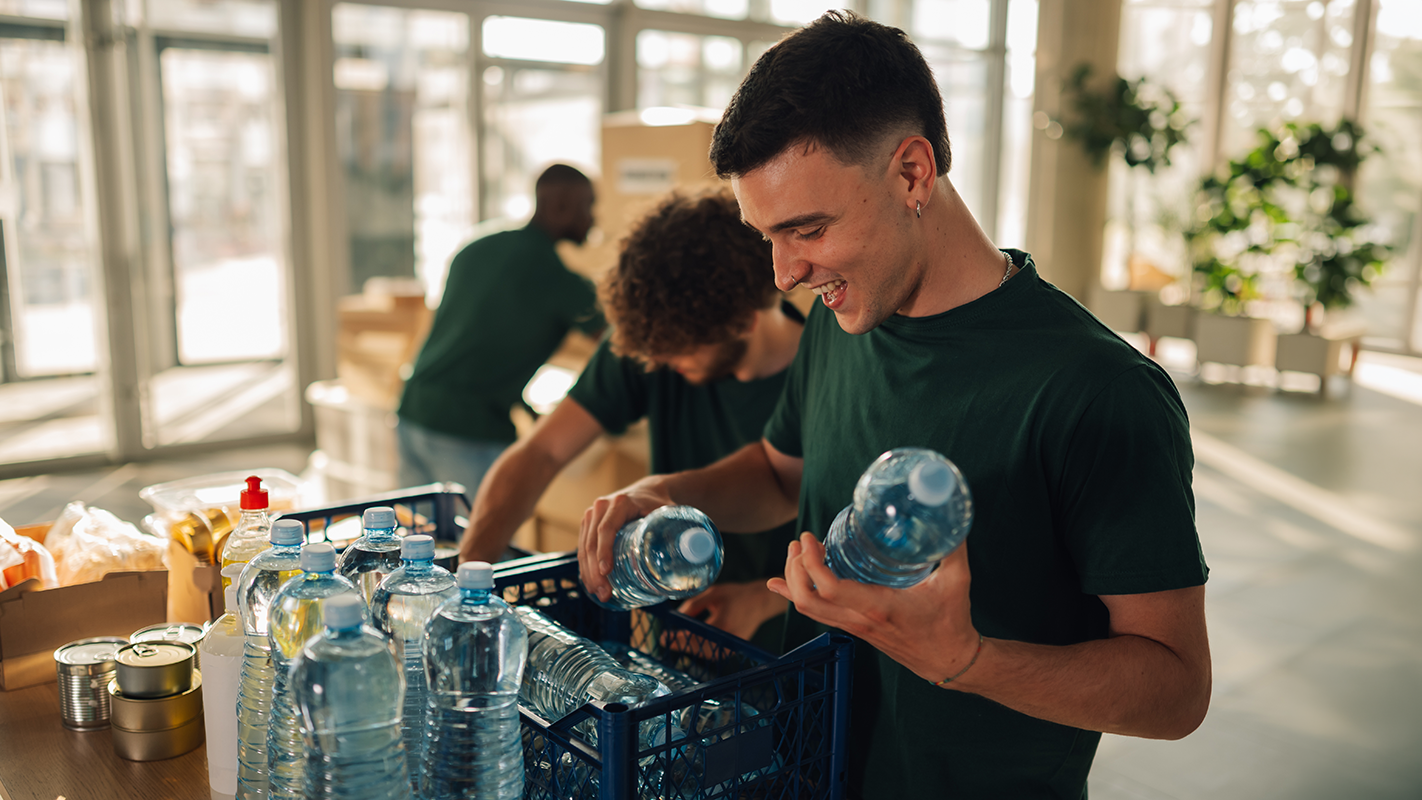 Man putting water bottles in kit