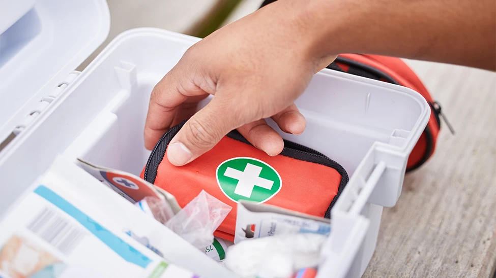 A person assembling a preparedness kit