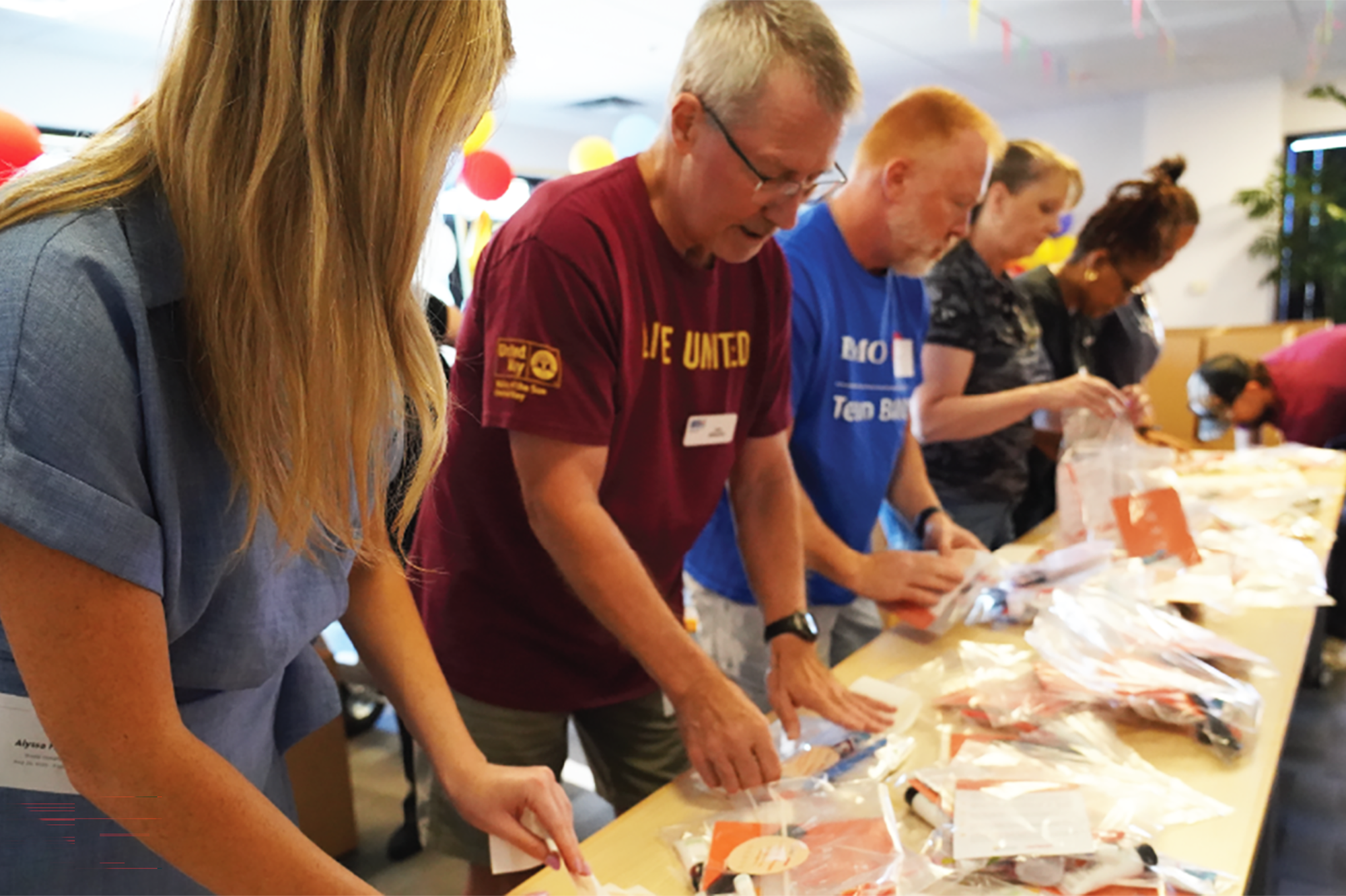 Volunteers in Phoenix assemble heat relief kits