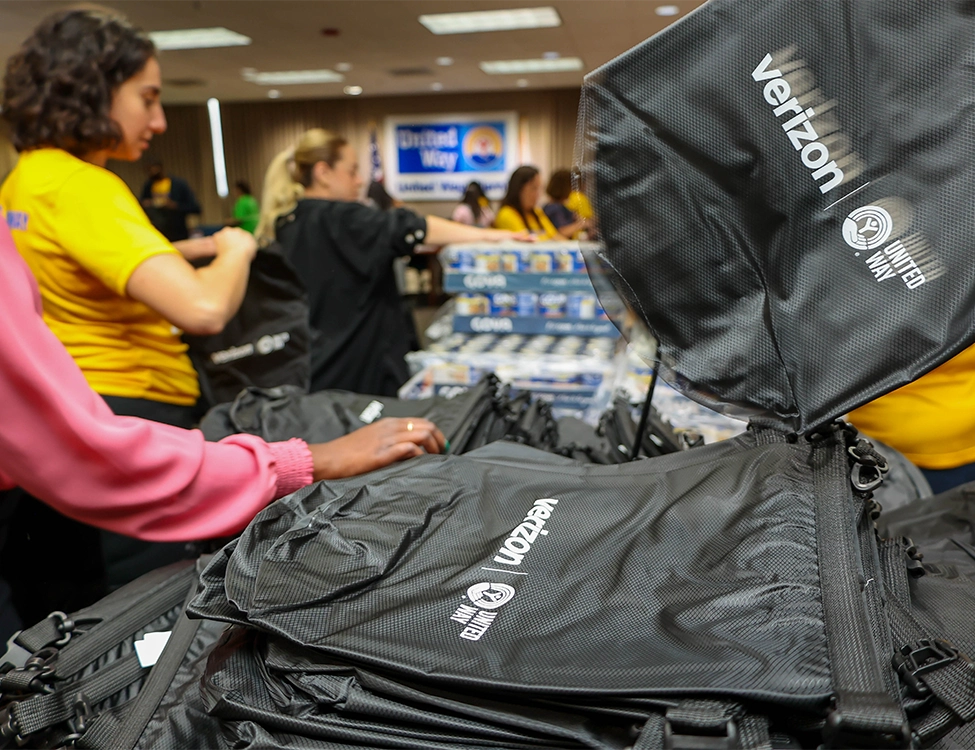 United Way staffers pack Verizon emergency kits for at-risk residents through the United We Prepare initiative