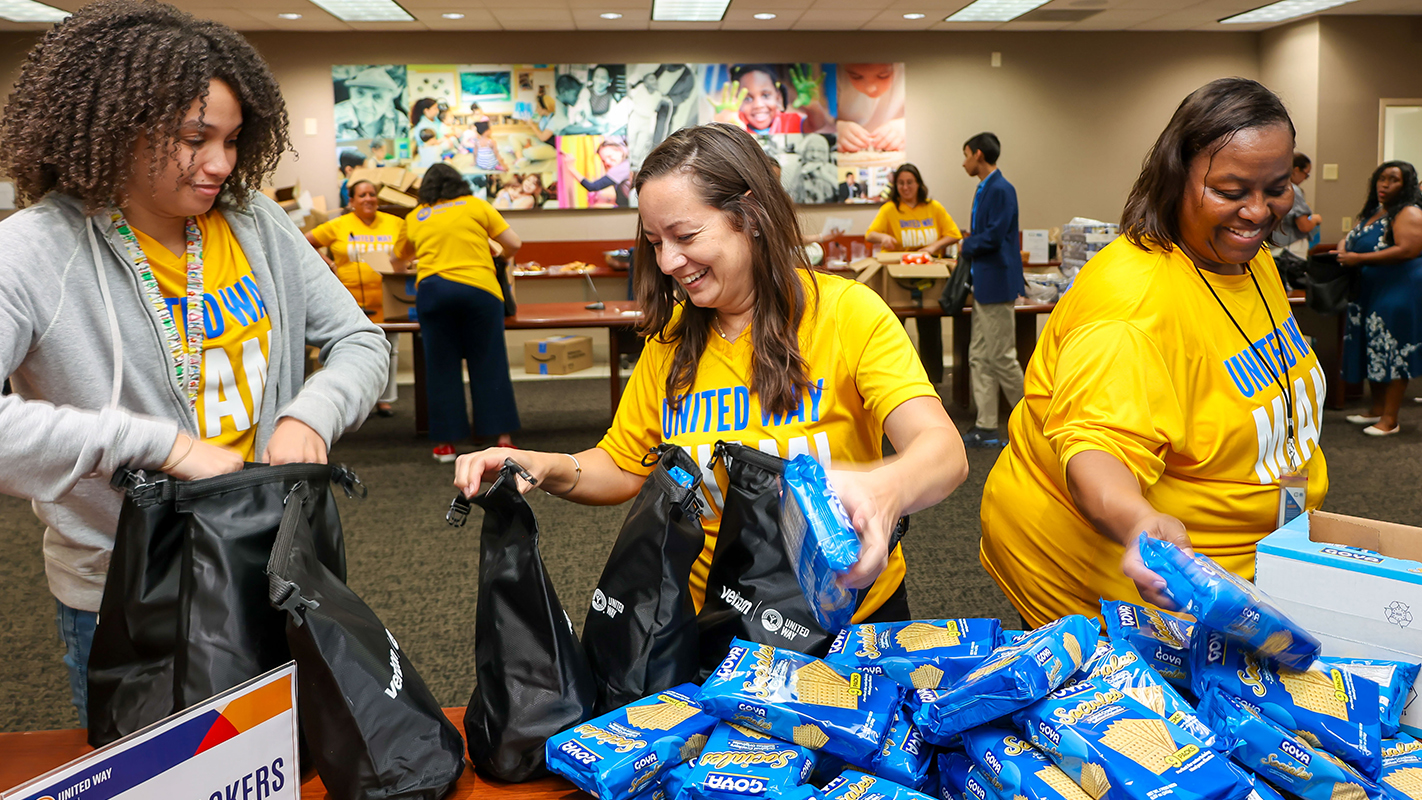 United Way Miami workers pack emergency kits for the United We Prepare initative