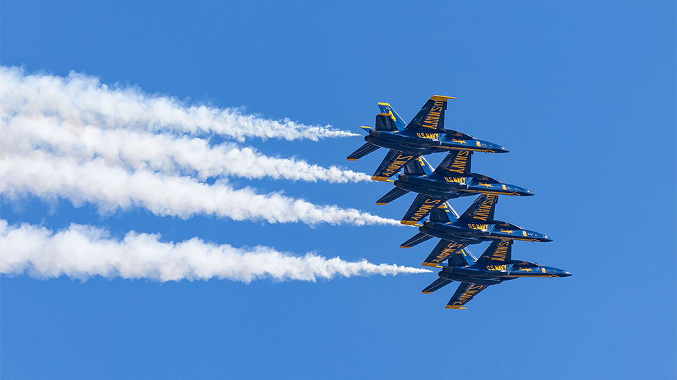 Four fighter jets flying in formation