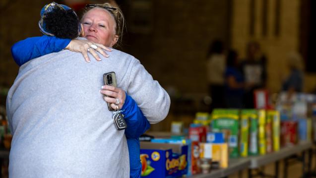 Two adults sharing a hug