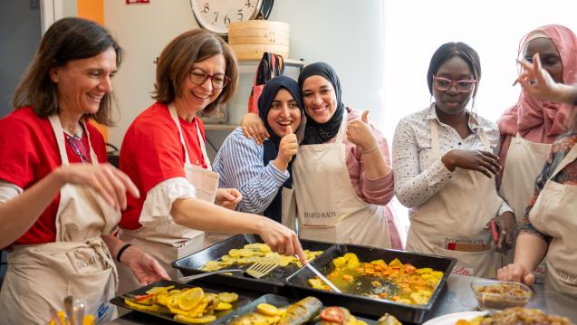 Women cooking healthy foods together