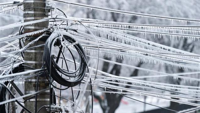Power lines weighed down by snow and ice