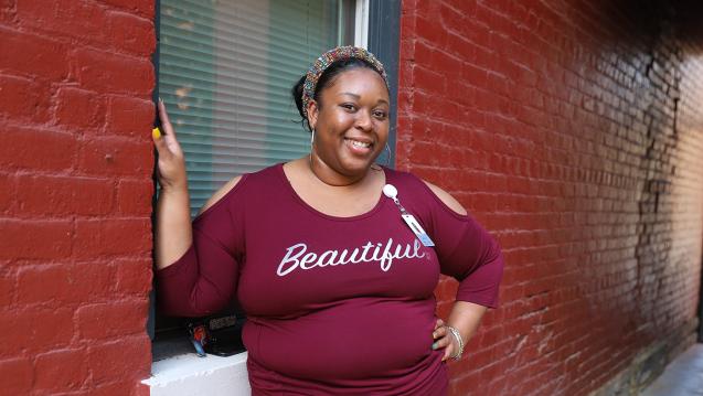 Ariel smiling wearing shirt that says beautiful. 