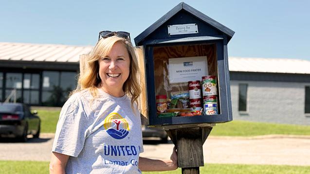 Jenney Wilson standing beside a mini-pantry in Lamar County, Texas