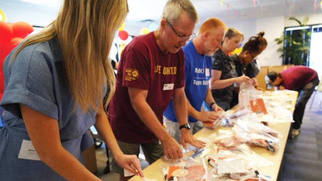 Volunteers in Phoenix assemble heat relief kits
