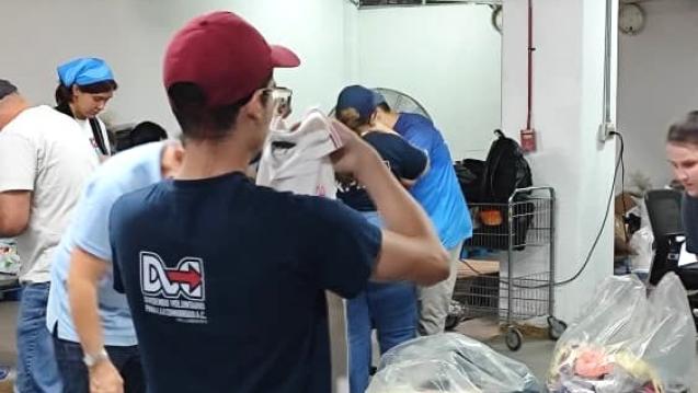 Volunteers Sorting Clothing Donations