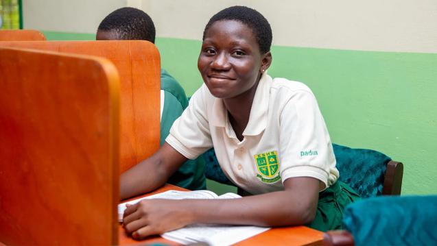 A student smiling in the refurbished library