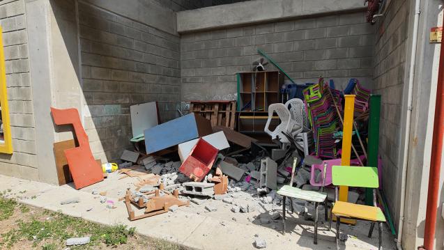 An early childhood classroom with broken desks in the aftermath of the earthquake in Colombia