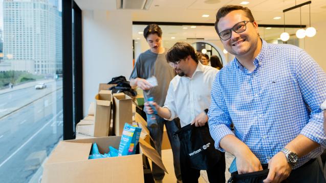 Member of United Way of Chicago's Young Leaders United packing emergency kits