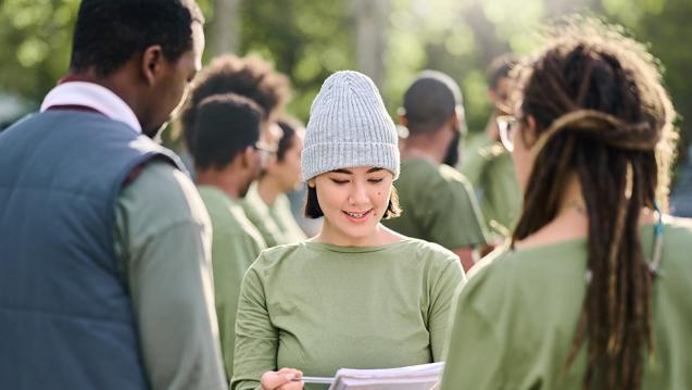 A woman reviewing a list in an evacuation drill