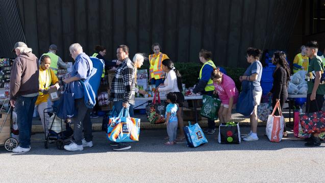People waiting in a line at a United Way of Southeastern Connecticut food bank
