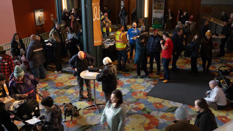 Group of individuals gathered in a large room 