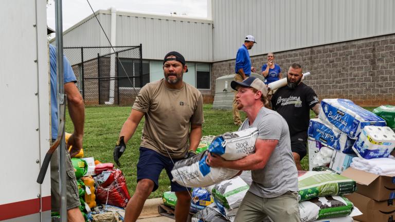 Volunteers organizing and distributing donated goods