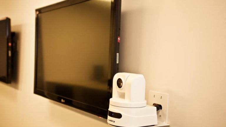 Camera and screen of the webinar room in the Mary M. Gates Learning Center