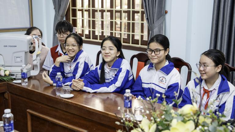 Students wearing their new glasses