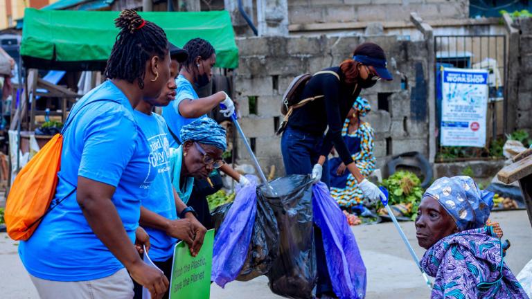 United Way staff and volunteers cleaning up market streets in Nigeria