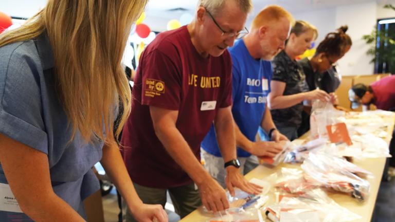 Volunteers in Phoenix assemble heat relief kits