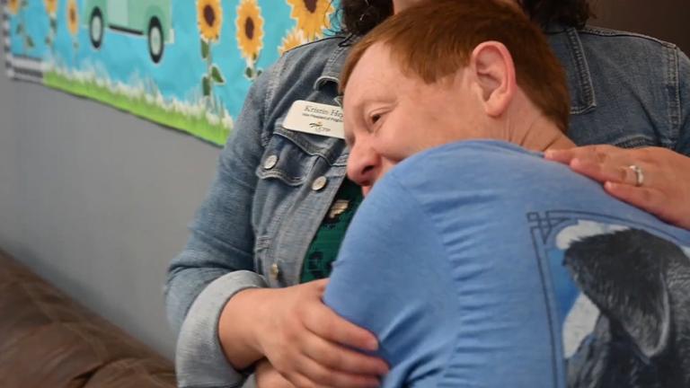 Young person hugging Kristin Hegji