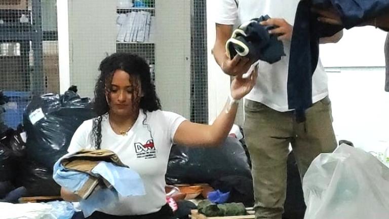 Volunteers Sorting Clothing Donations