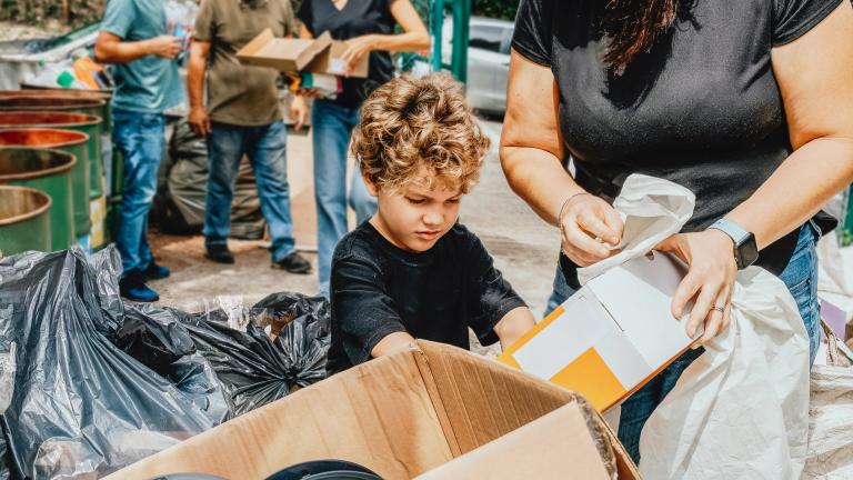 Venezuelan boy holding a box