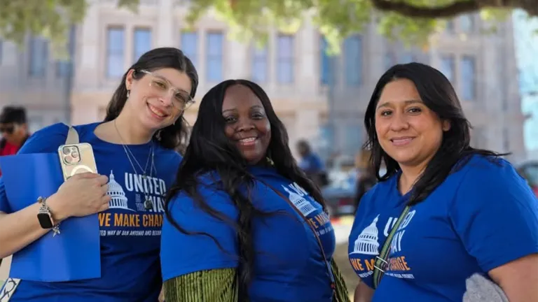 Three recipients of the scholarships smiling in front of the Texas Capitol in Austin