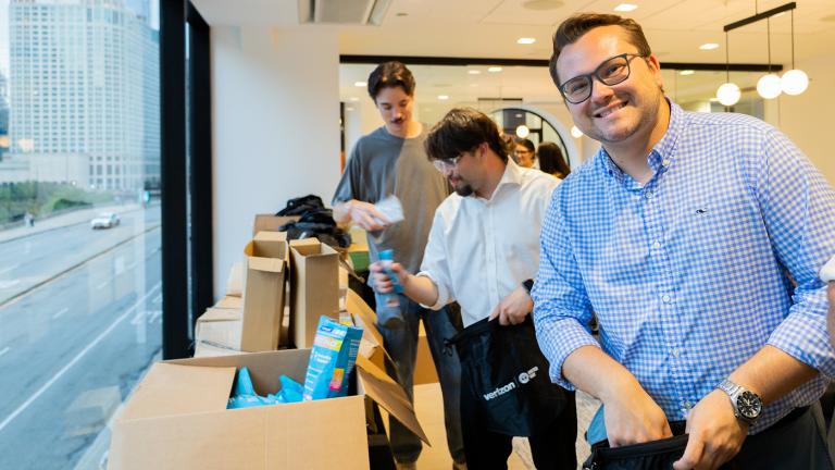 Member of United Way of Chicago's Young Leaders United packing emergency kits