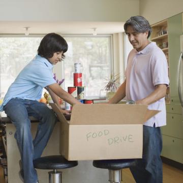 father and son food volunteering