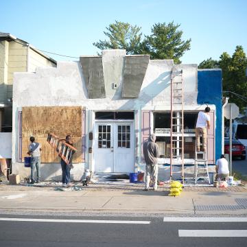 People outside doing construction