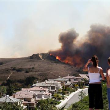 Residents watch as wildfire approaches their home