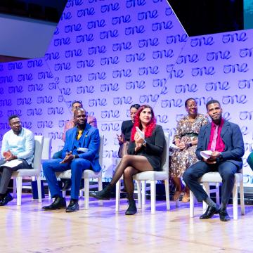 Young leaders on a stage at One Young World Conference