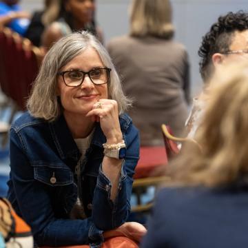 Woman intently learning in a conference room