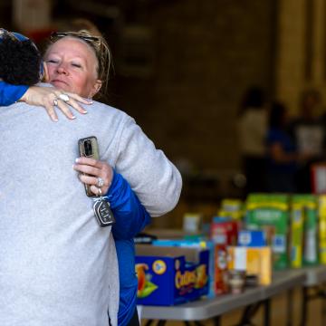 Two adults sharing a hug
