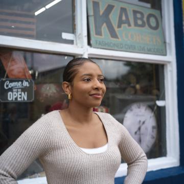 Young employee standing outside of a business