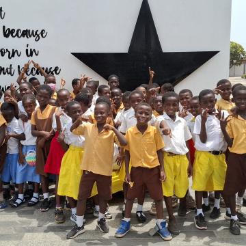 Second Graders in United Way Ghana exchange project smile for a group photo.