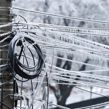 Power lines weighed down by snow and ice