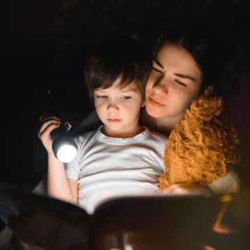  A mother reads a bedtime story.