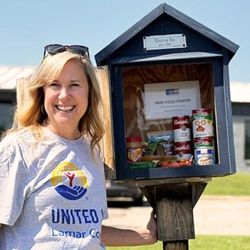 Jenney Wilson standing beside a mini-pantry in Lamar County, Texas