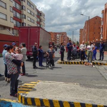 People evacuating outside after an earthquake