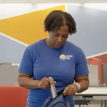 A woman packing her go bag