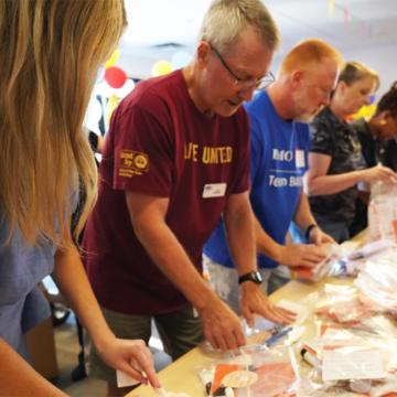 Volunteers in Phoenix assemble heat relief kits