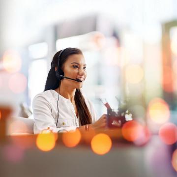 Woman wearing telephone headset