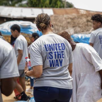 People wearing United is the Way T-shirts in Ghana