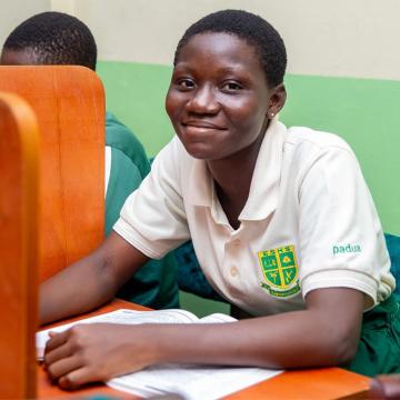 A student smiling in the refurbished library