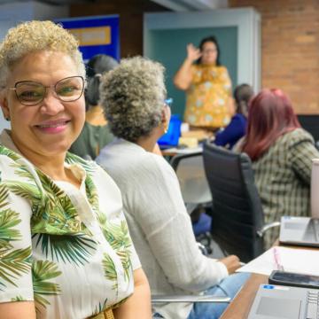 A participant in the Extreme Heat workshop for caregivers smiles at the camera