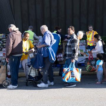 People waiting in a line at a United Way of Southeastern Connecticut food bank