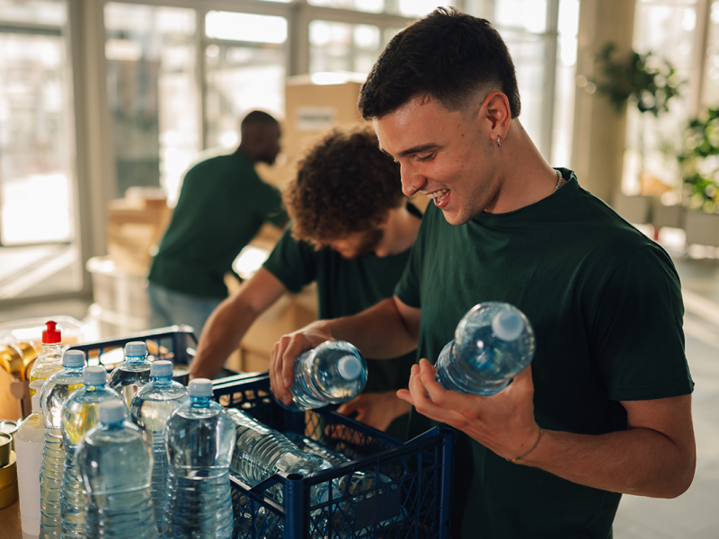 Man putting water bottles in kit