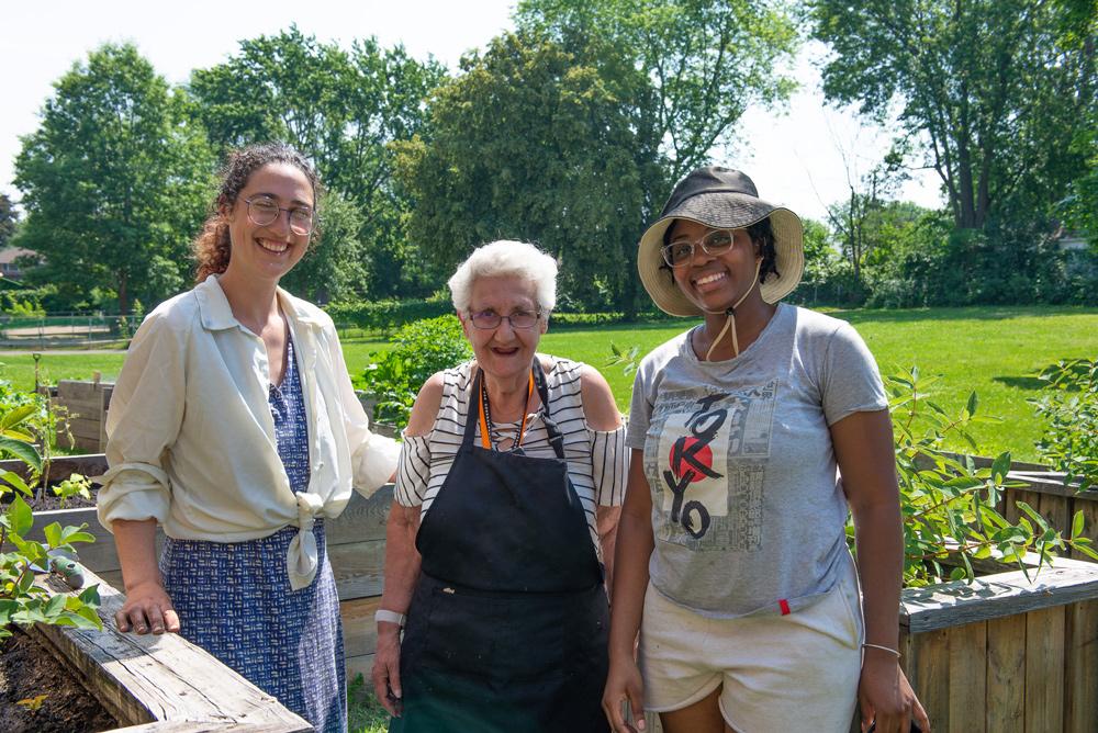 Three women standing in the garden